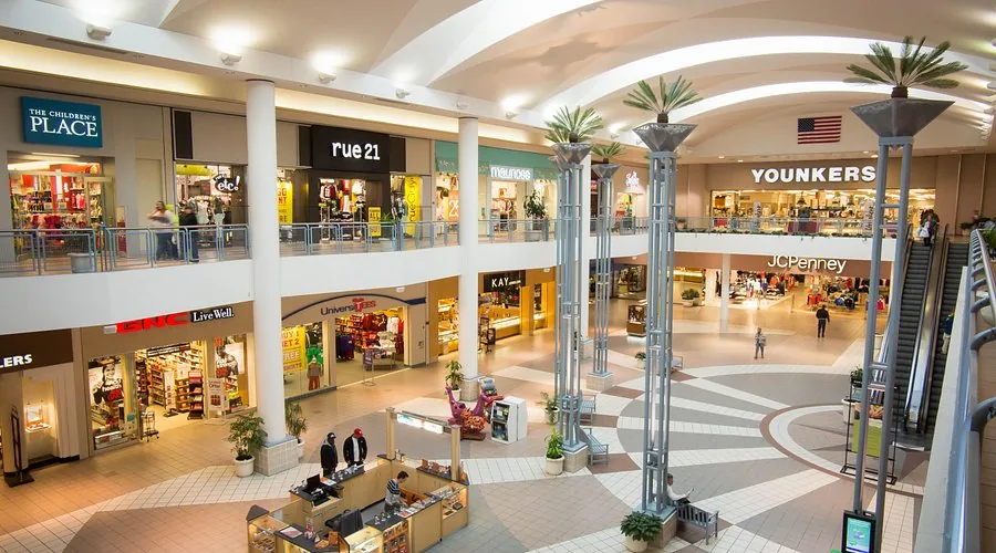 Interior of a shopping mall with storefronts